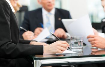 Businessmen discussing the details of business dispute with attorneys Augusta GA