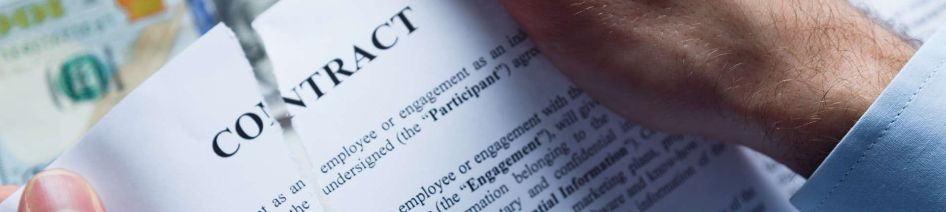 a person tearing contract