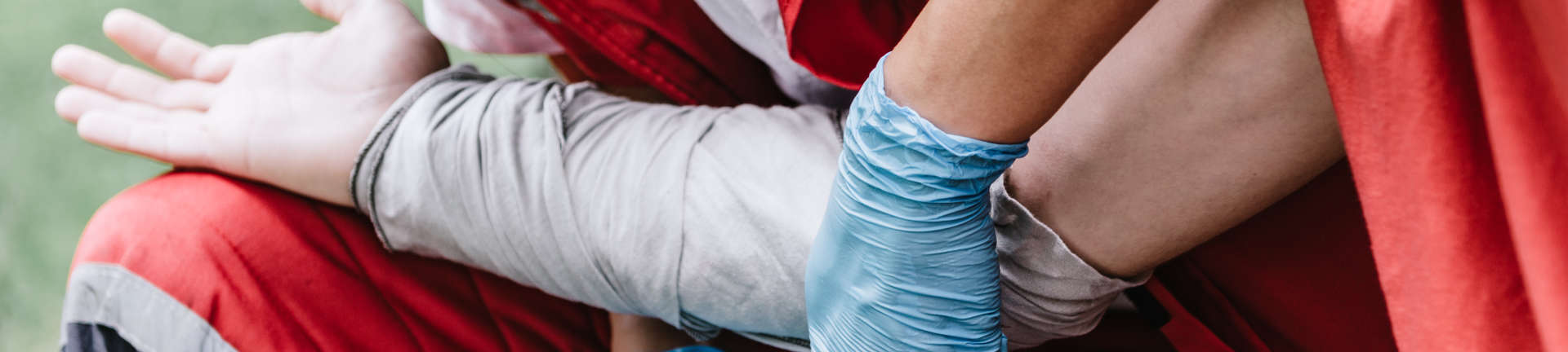 paramedics wrapping a wounded arm of an electical injury victim