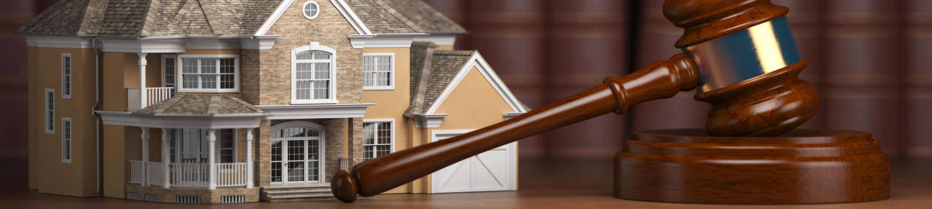 judge's gavel and a model of a house