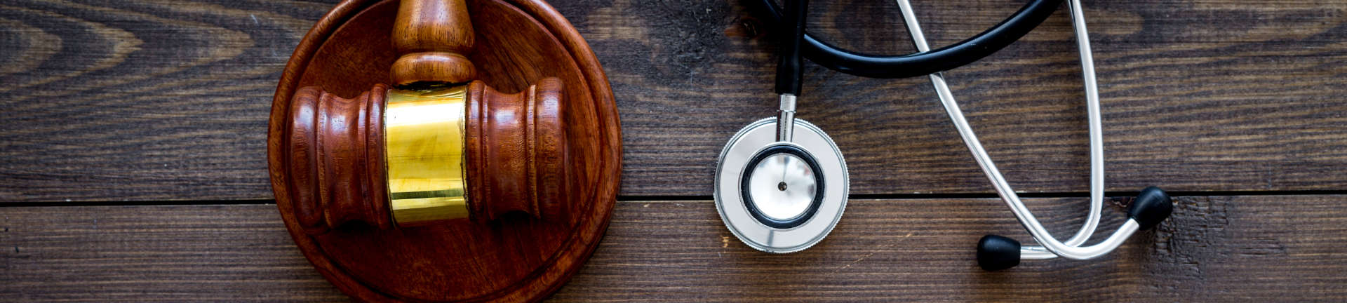 Judges gavel and a stethoscope on a desk of Personal Injury Workers Comp Attorney Augusta GA